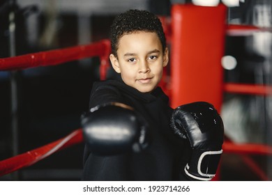 Young hardworking boxer learning to box. Child at sport center. Kid taking up a new hobby