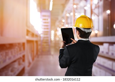 Young hardworking supervisor posing in warehouse.
