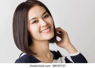 Young Healthy Asian Short Hair Woman With Smiley Face.