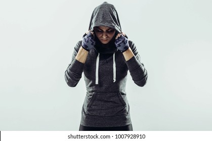 Young healthy athlete woman with perfect body posing in front of camera. Young healthy athlete female posing against white background