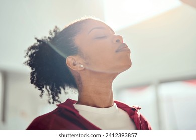 Young healthy fit sporty beautiful African American woman wearing sportswear standing with eyes closed lit with sunlight doing yoga exercises breathing fresh air. Close up. Mental balance concept. - Powered by Shutterstock