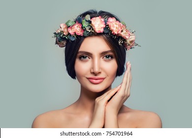Young Healthy Woman with Flowers. Spa Model on Blue Banner Background. Skincare and Cosmetology Concept