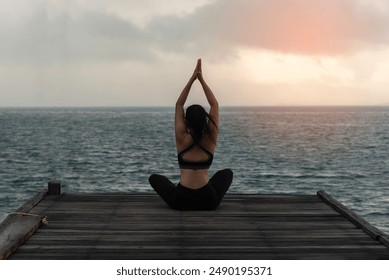 Young healthy woman practicing yoga on the bridge in the nature
 - Powered by Shutterstock