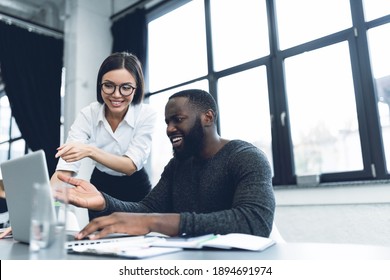Young and heterogeneous co-workers working with pc in the office - Shutterstock ID 1894691974