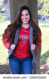 Young High School Senior Posing For Graduation Pictures