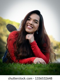 Young High School Senior Posing For Graduation Pictures