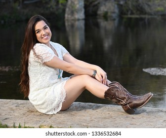 Young High School Senior Posing For Graduation Pictures