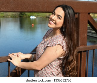 Young High School Senior Posing For Graduation Pictures