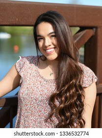 Young High School Senior Posing For Graduation Pictures