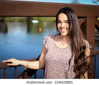 Young High School Senior Posing For Graduation Pictures