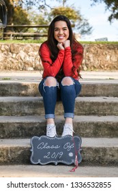 Young High School Senior Posing For Graduation Pictures