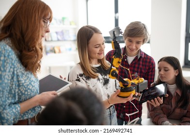 Young High School Student Is Presenting Her Robotic Project In Classroom