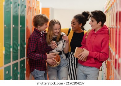Young high school students meeting and greeting near locker in campus hallway, back to school concept. - Shutterstock ID 2190204287