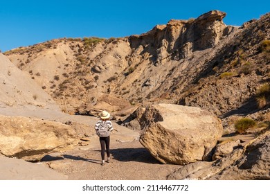 A Young Hiker In The Desert Of Tabernas, Almería Province, Andalusia. On A Trek In The Rambla Del Infierno