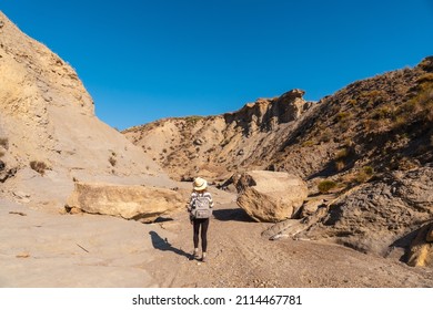 A Young Hiker In The Desert Of Tabernas, Almería Province, Andalusia. On A Trek In The Rambla Del Infierno