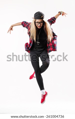 young hip-hop dancer posing in studio