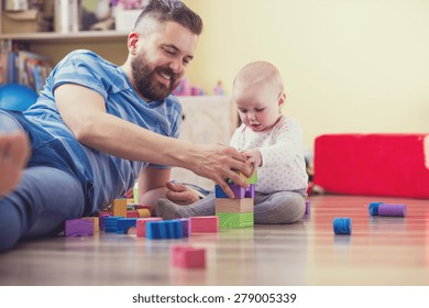 Young Hipster Father Playing With His Daughter