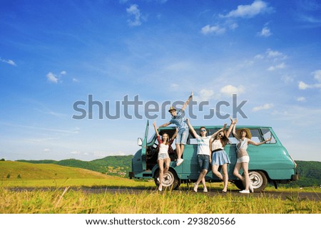 Young hipster friends on road trip on a summers day