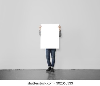 Young Hipster Holding Blank Poster