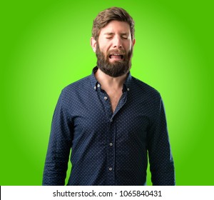 Young Hipster Man With Big Beard Crying Depressed Full Of Sadness Expressing Sad Emotion Over Green Background