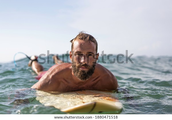 Young Hipster Man Swimming On Surfboard Stock Photo (Edit Now) 1880471518