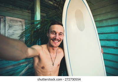 A Young Hipster Surfer Making Selfie With His Surf At Beach House At Ocean Side