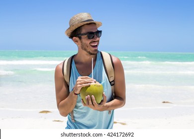 Young hipster using his smart phone on holidays in Mexico.