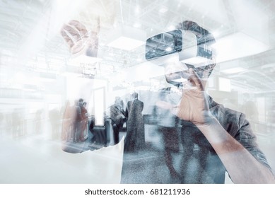 Young Hipster Wearing Virtual Reality Goggles On A Games Trade Fair