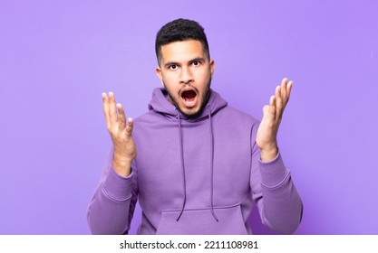 Young Hispanic Athlete Man Scared Expression