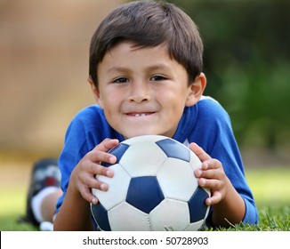 Young Hispanic Boy With Soccer Ball