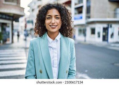 Young Hispanic Business Woman Wearing Professional Look Smiling Confident At The City