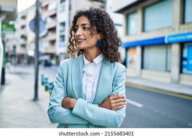 Young Hispanic Business Woman Wearing Professional Look Smiling Confident At The City