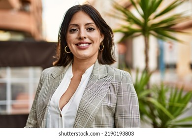 Young Hispanic Businesswoman Smiling Happy Standing At The City.