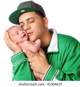 A Young Hispanic Dad Loving On His Newborn Son.  Isolated On White.