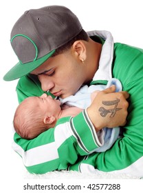 A Young Hispanic Dad Loving On His Newborn Son.  Isolated On White.