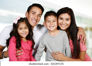 Young Hispanic Family Who Love Being With Each Other