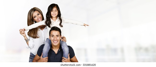 Young Hispanic Family Who Love Being With Each Other