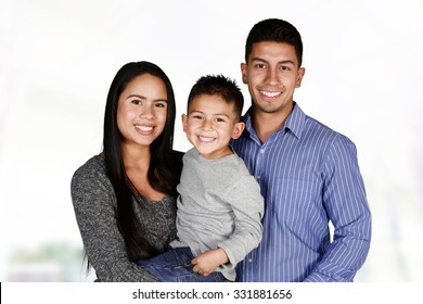 Young Hispanic Family Who Love Being With Each Other