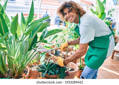 Young Hispanic Gardener Smiling Happy Caring Plants Using Pruning Shears At Terrace