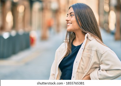 Young hispanic girl smiling happy standing at the city. - Shutterstock ID 1855765381