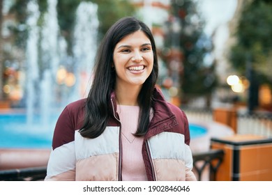 Young Hispanic Girl Smiling Happy Standing At The Park.