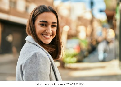 Young Hispanic Girl Smiling Happy Standing At The City.