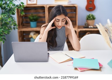 Young Hispanic Girl Stressed Studying At Home