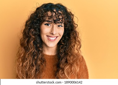 Young hispanic girl wearing casual clothes with a happy and cool smile on face. lucky person. 