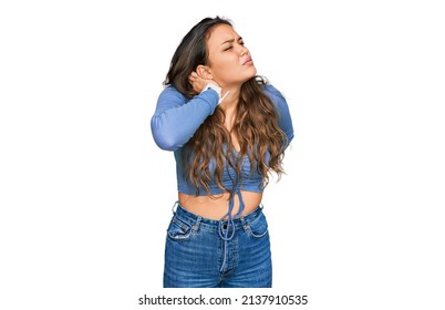 Young Hispanic Girl Wearing Casual Clothes Suffering Of Neck Ache Injury, Touching Neck With Hand, Muscular Pain 