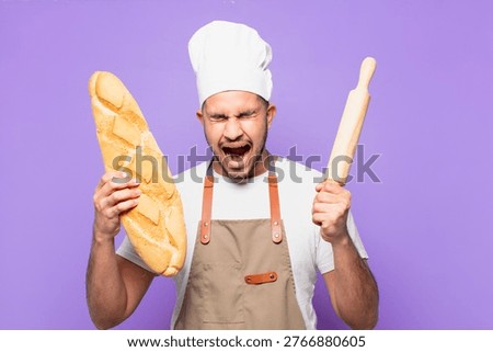 young hispanic man angry expression. chef or baker concept