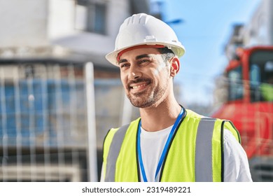 Young hispanic man architect smiling confident standing at street - Powered by Shutterstock