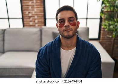 Young hispanic man with beard wearing beauty eyes patch thinking attitude and sober expression looking self confident  - Powered by Shutterstock