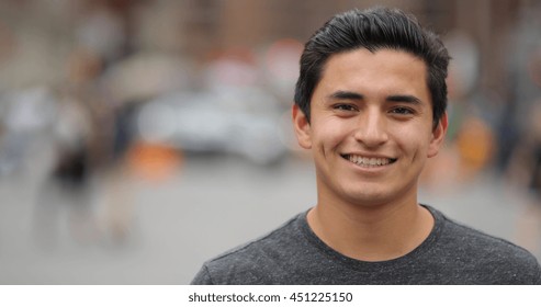 Young Hispanic Man In City Face Portrait