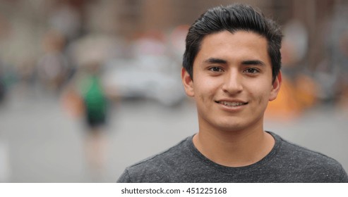 Young Hispanic Man In City Face Portrait